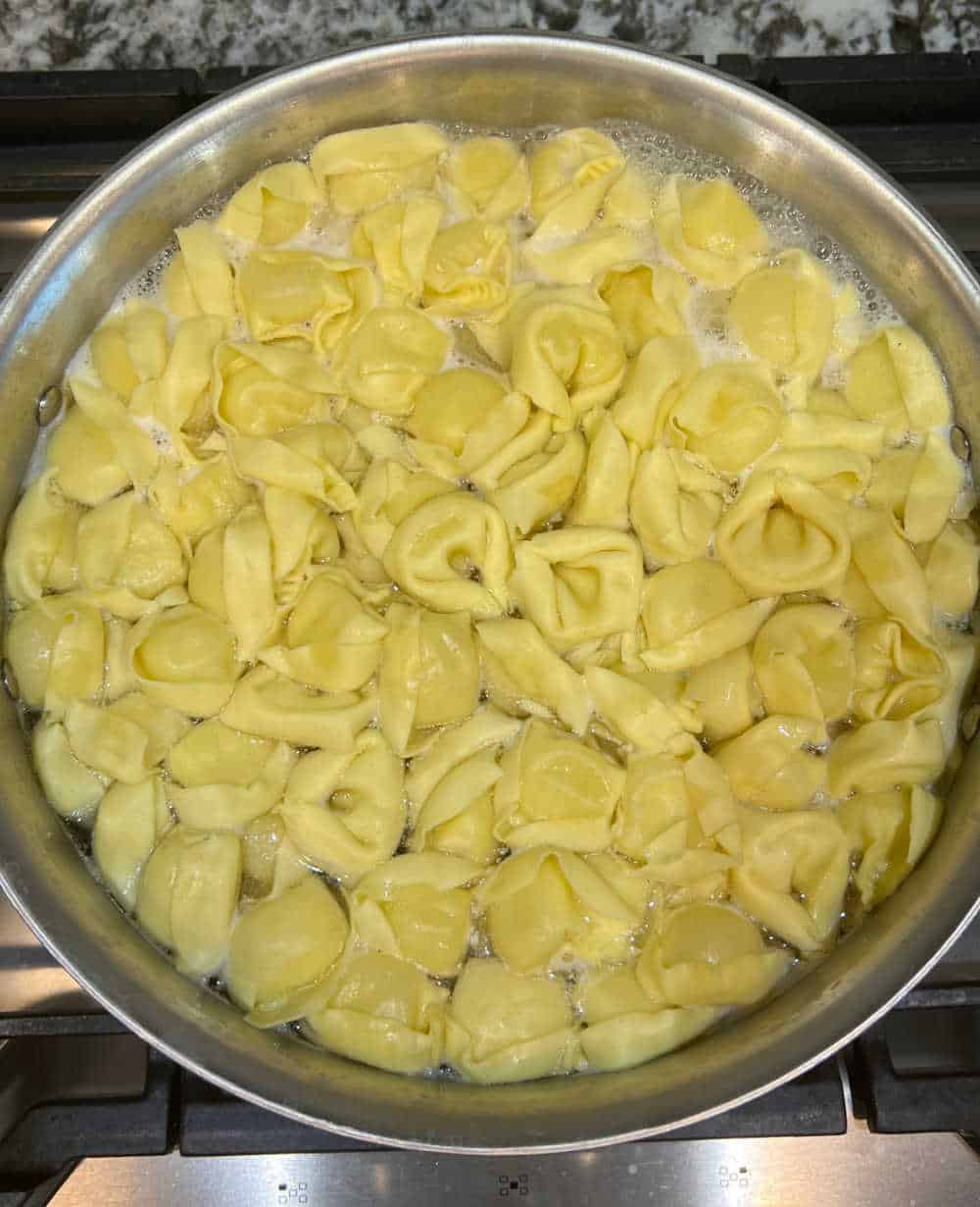 cook tortellini on stove.