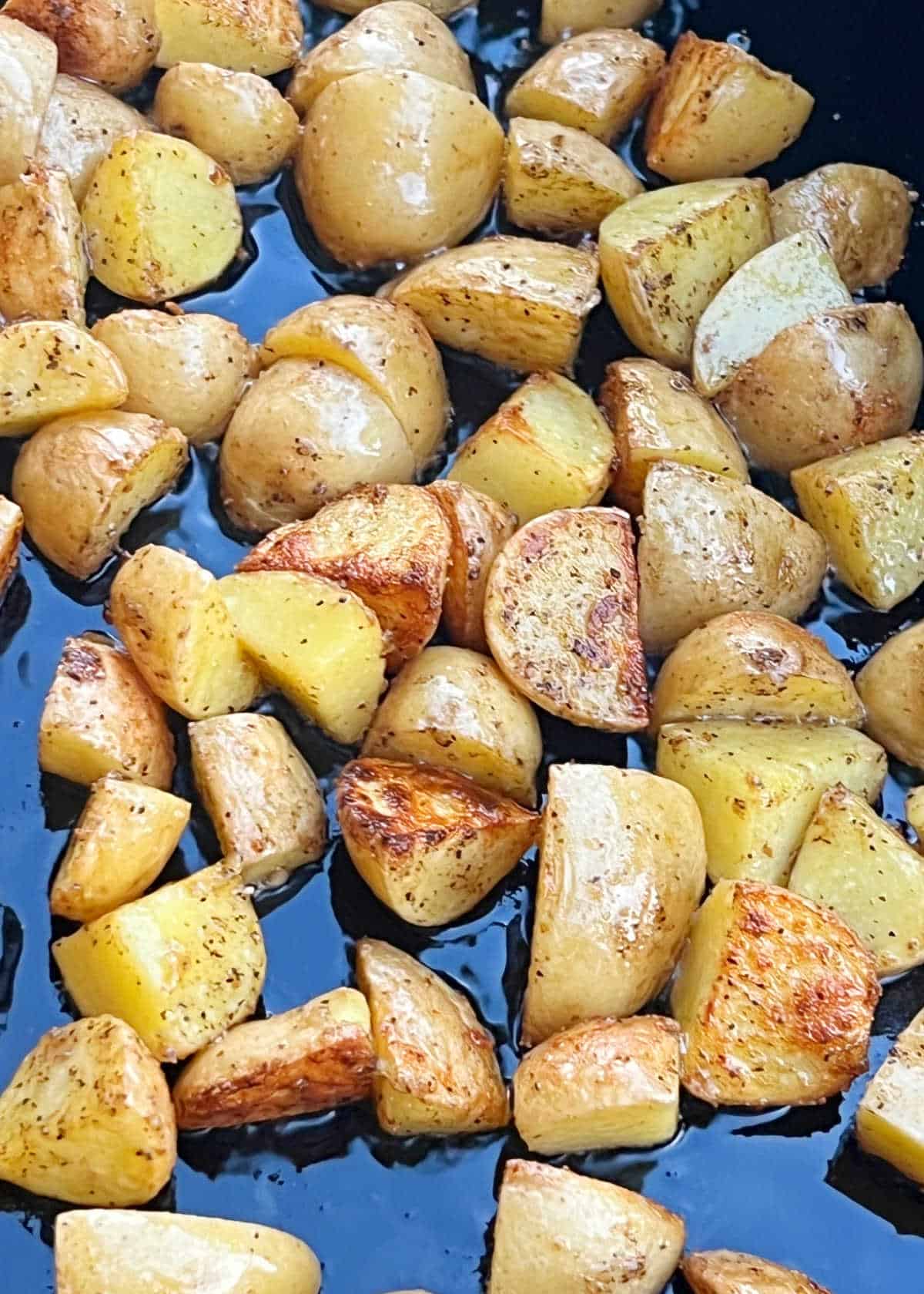 fried baby potatoes on blackstone griddle.