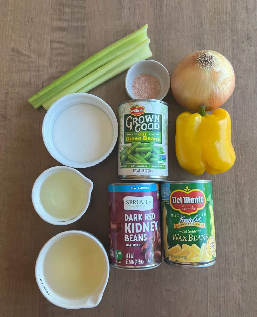 canned green beans, wax beans, kidney beans, onion, bell pepper, celery and dressing ingredients.