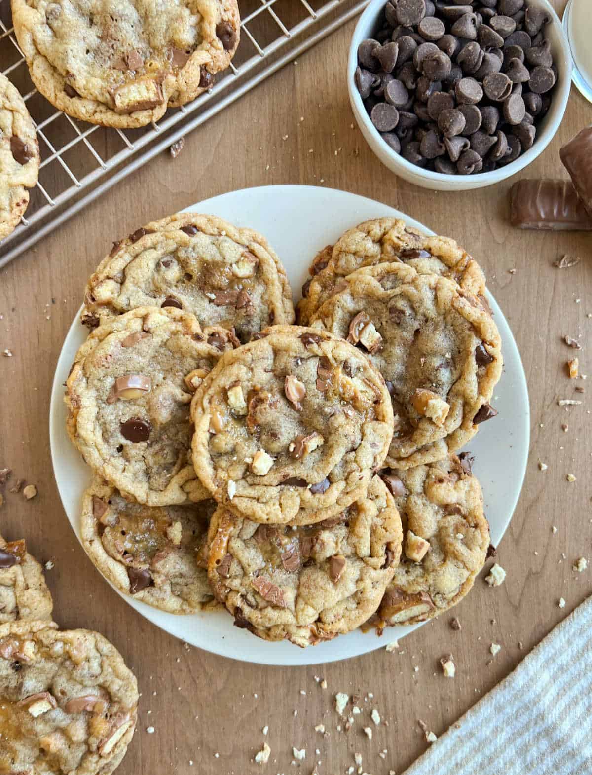 plate of Twix chocolate chip cookies on the table.
