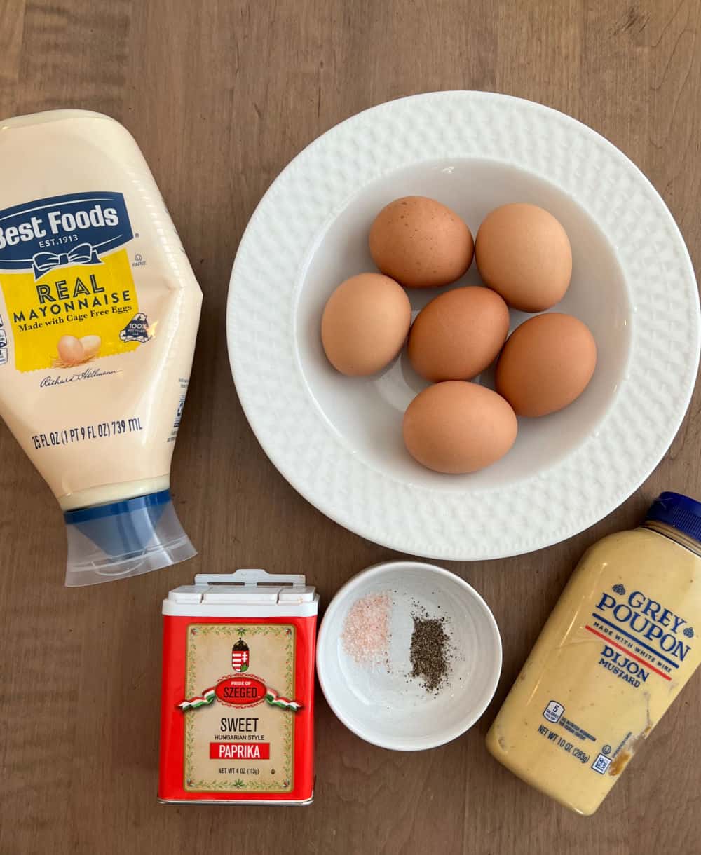 hard boiled eggs, mayo, mustard, salt, pepper, paprika.