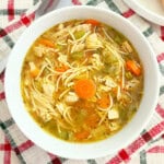 easy turkey soup with carrots, celery and noodles in bowl.