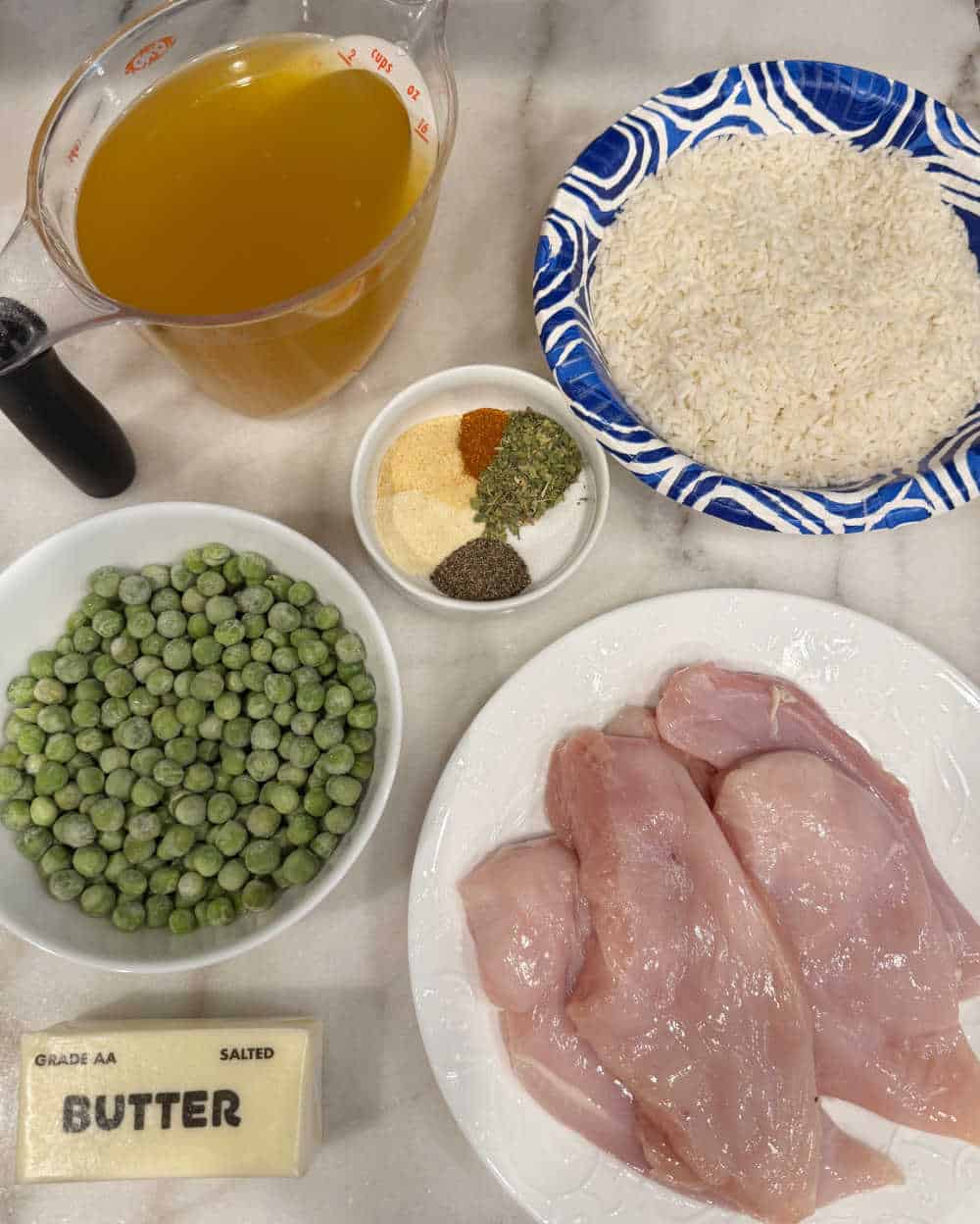 chicken, minute rice, peas, broth, butter, spices.