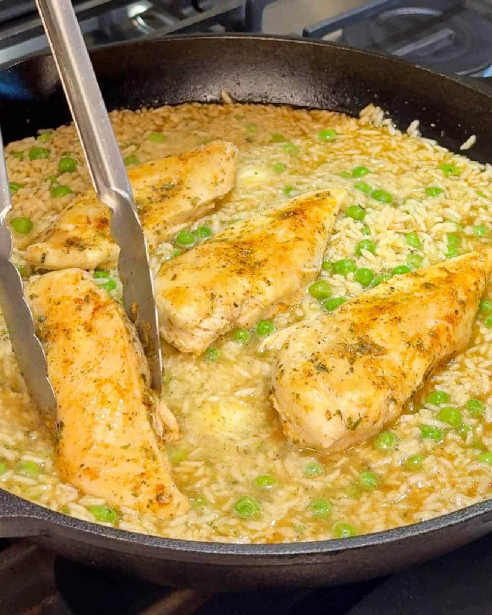 simmer chicken with rice in skillet.