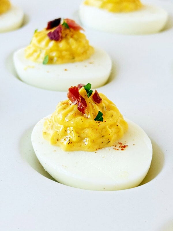 bacon ranch deviled eggs with parsley and paprika.