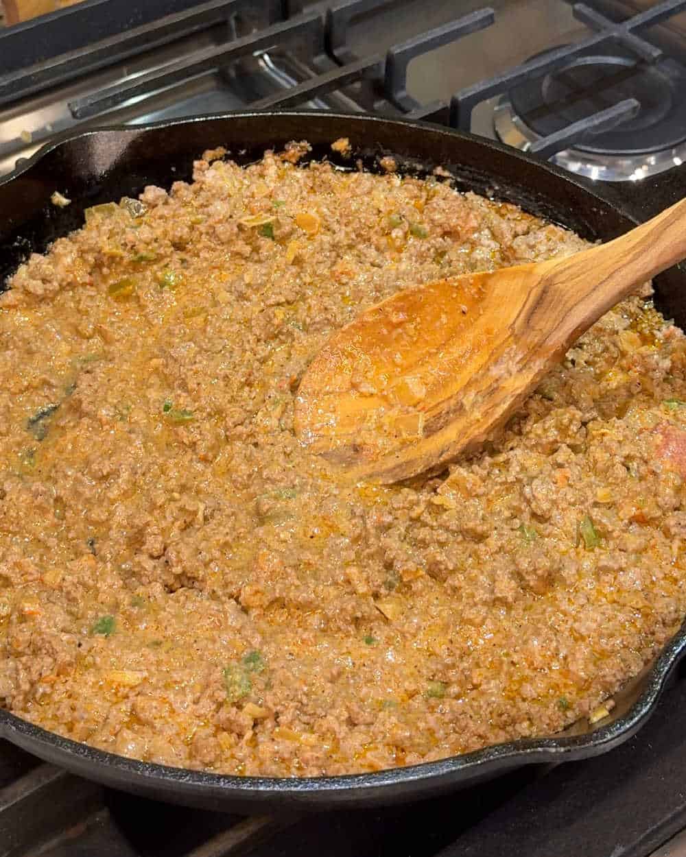 stir ground beef mixture with wooden spoon.