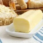 stick of homemade butter on a butter dish.