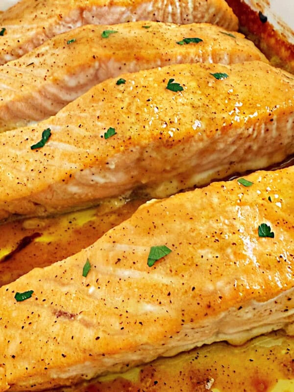 honey mustard salmon fillets in baking dish.