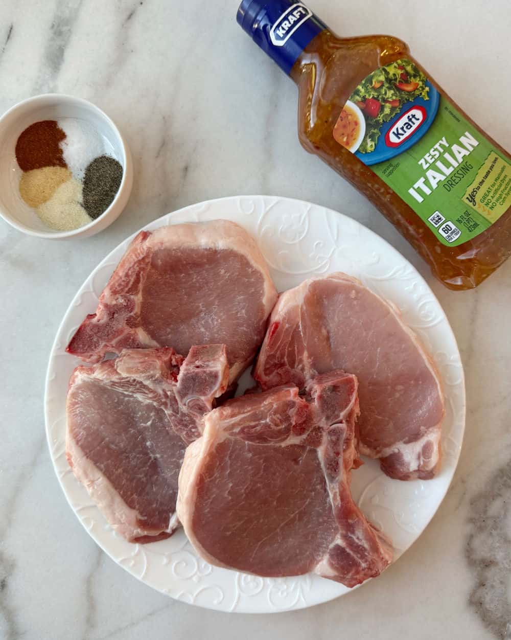bone-in pork chops, seasonings, Italian dressing.