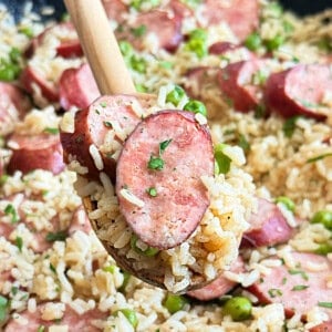 smoked kielbasa sausage and rice with parsley and peas.