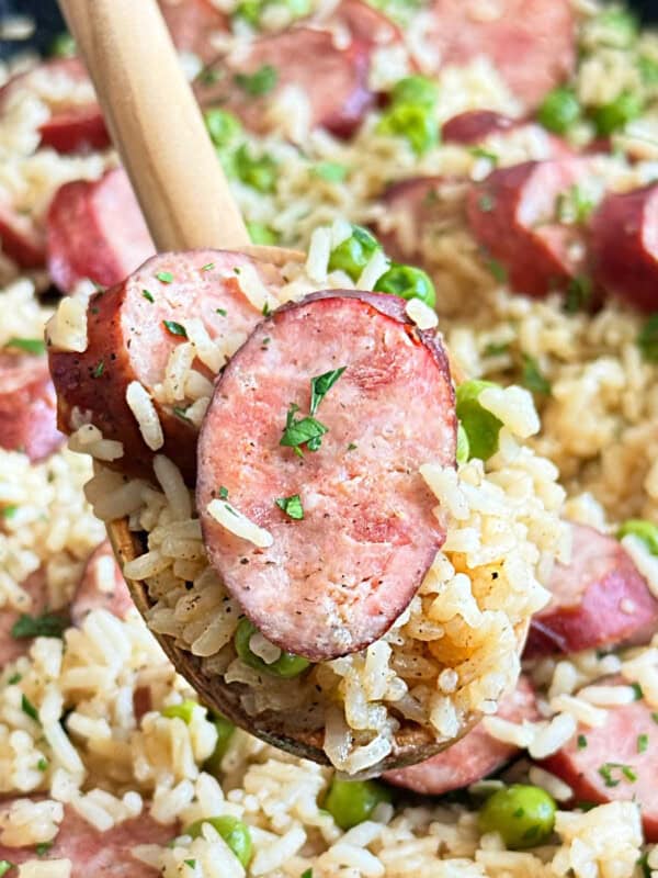 smoked kielbasa sausage and rice with parsley and peas.