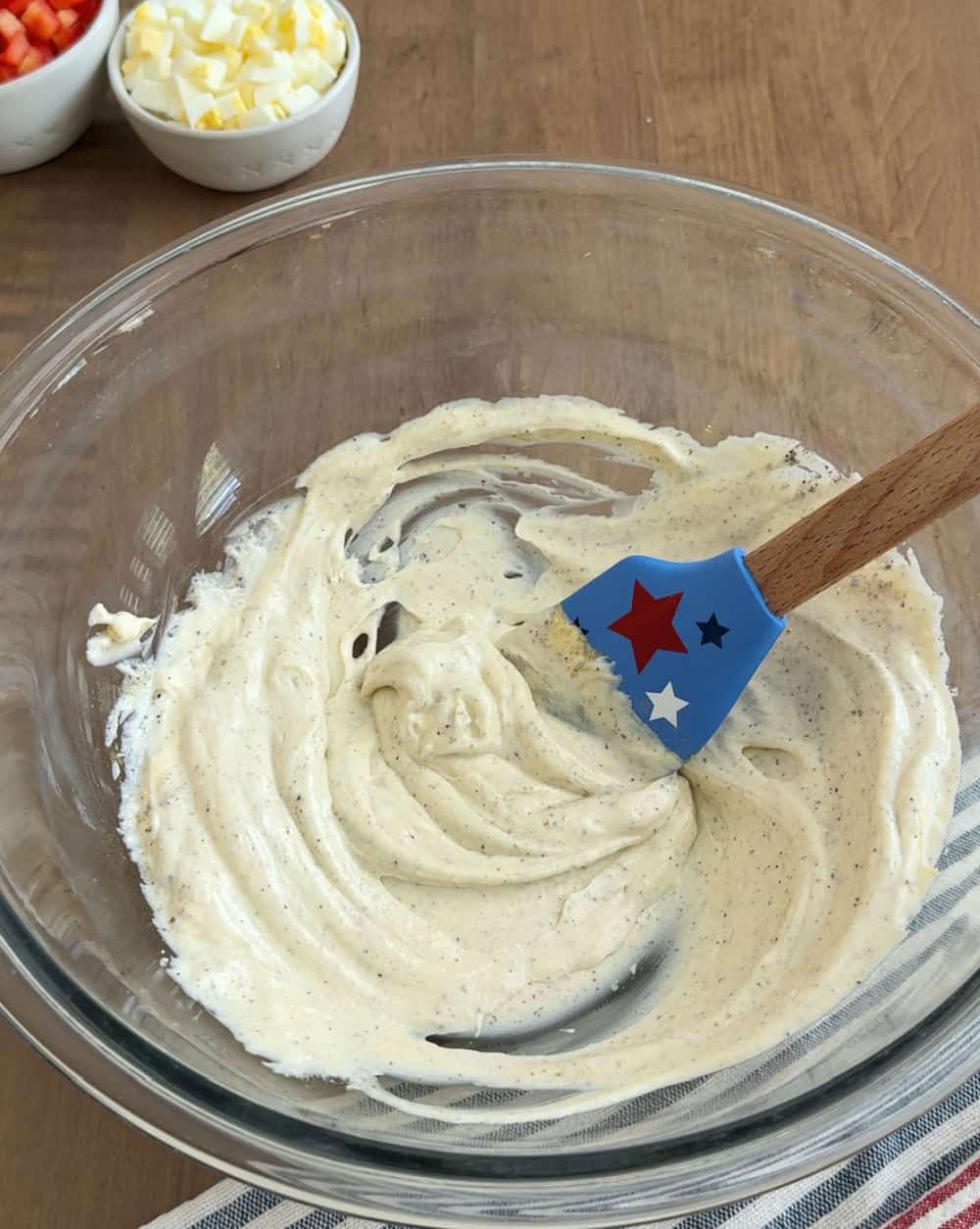 mix dressing in large bowl with patriotic spatula.