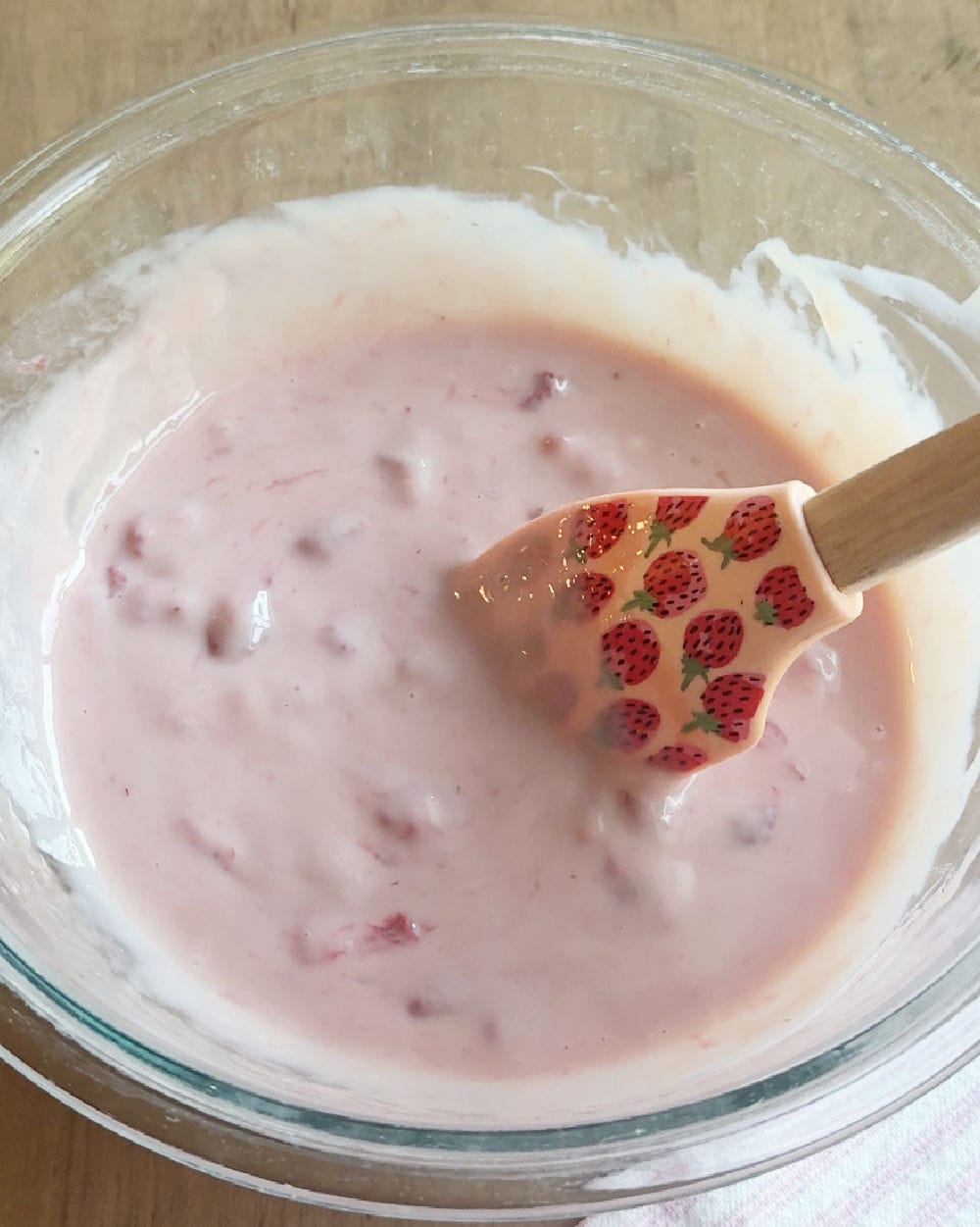stir strawberry mixture with milk in bowl.