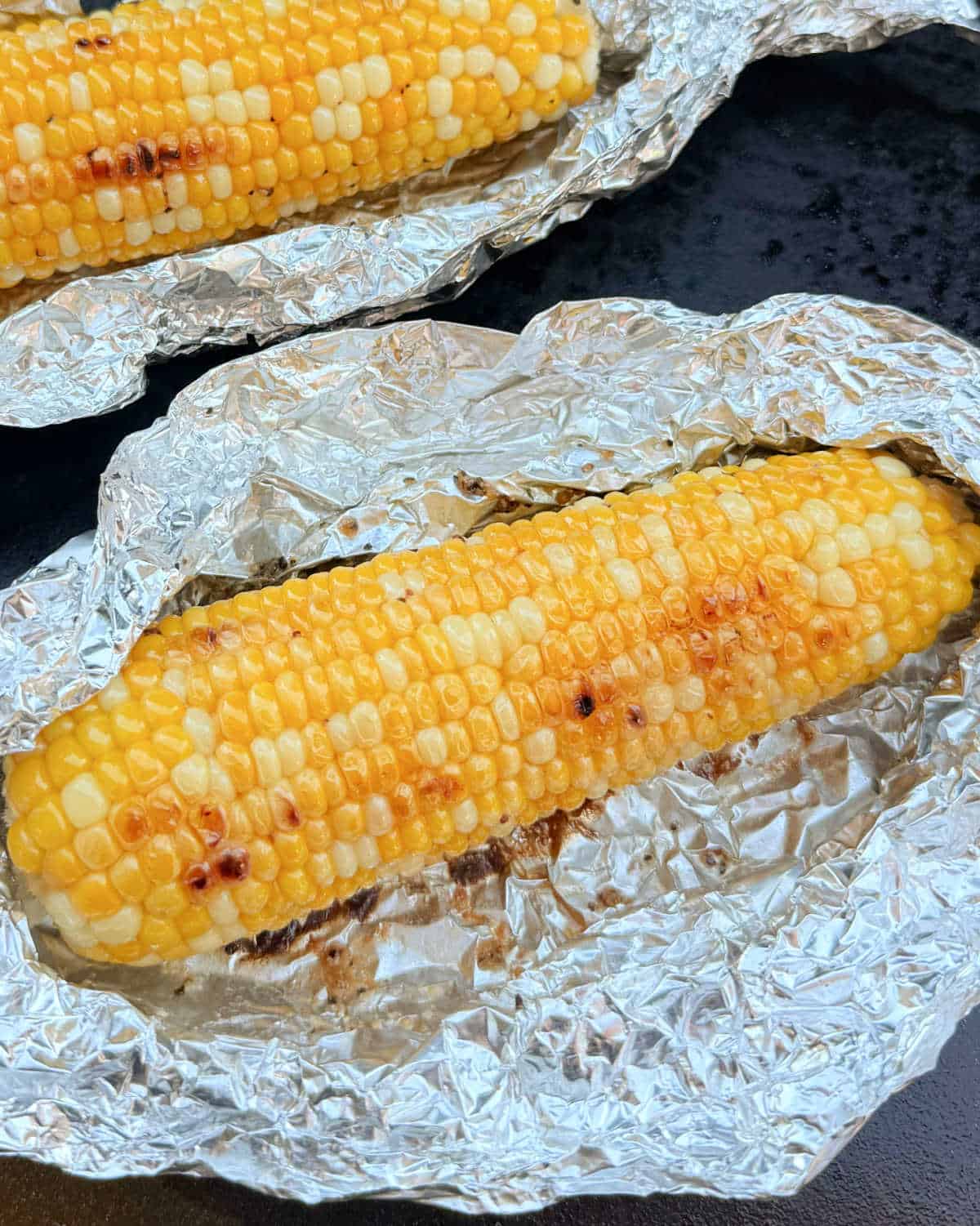 blackstone corn on the cob in open foil pack.