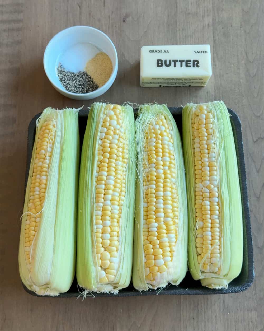 corn in husks, butter, seasonings.