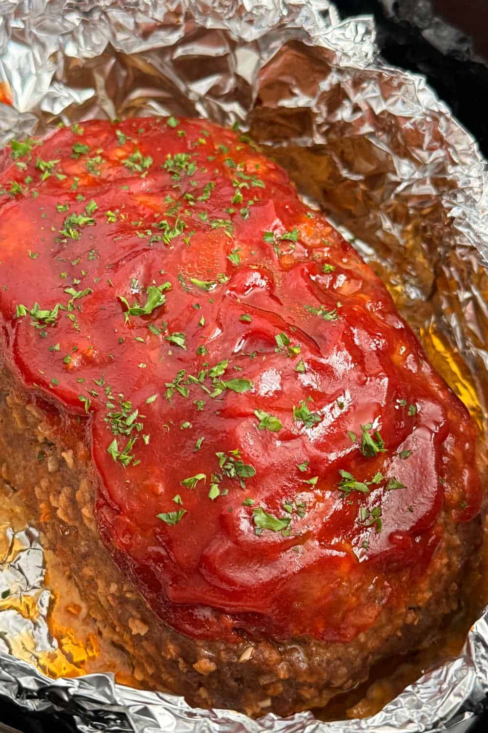 meatloaf cooked in the crockpot in foil.