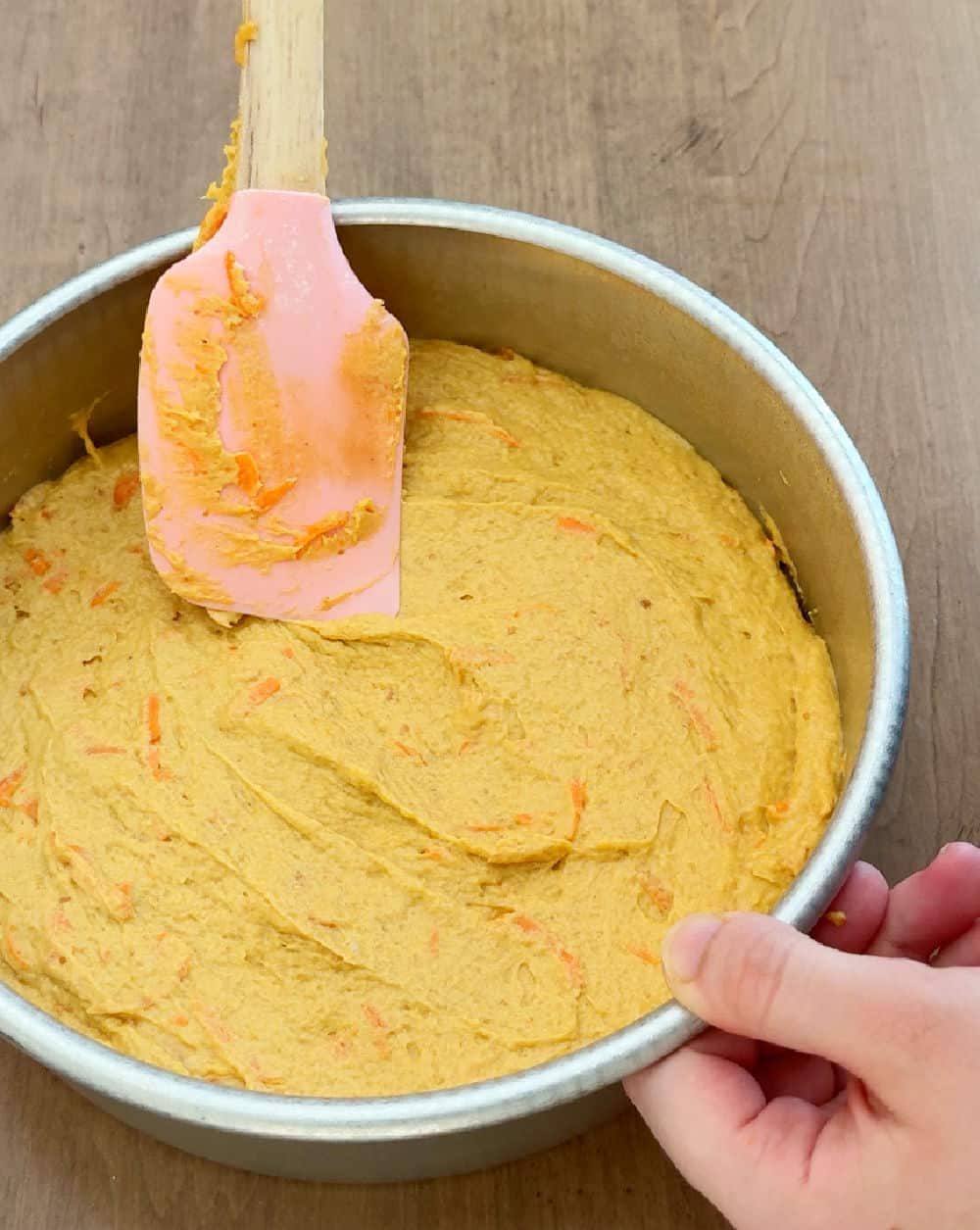 spread batter in cake pan.