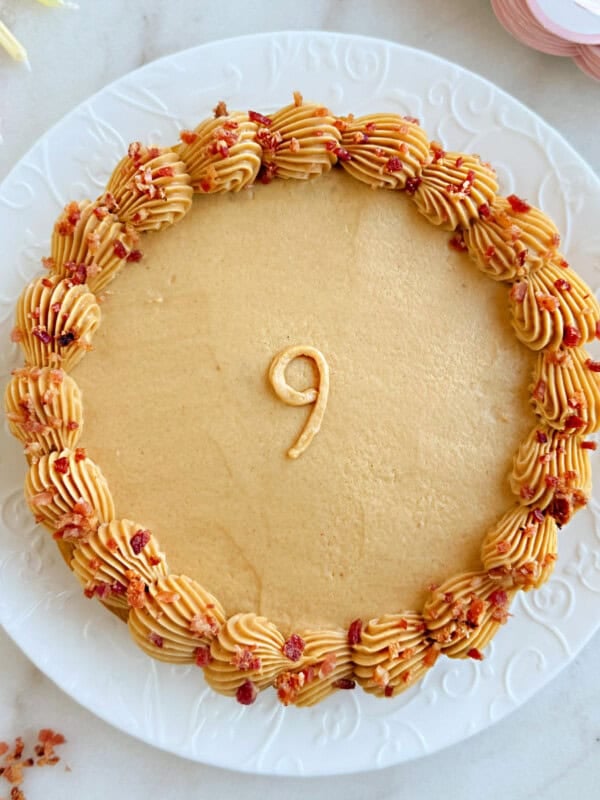 dog cake with peanut butter frosting and bacon crumbles.