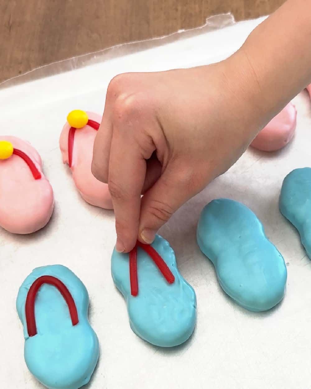 adding Twizzler strips to cookies.