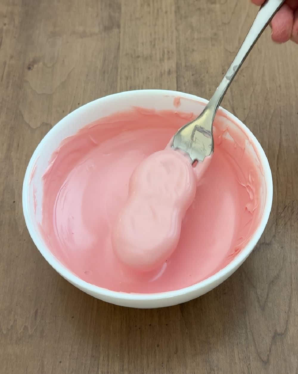 cookie dipped in pink candy coating.