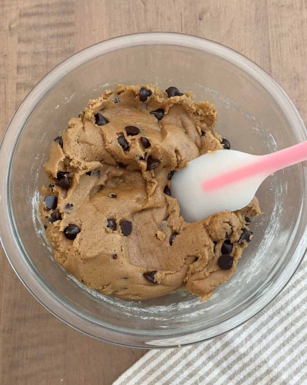 stir cookie dough with spatula.