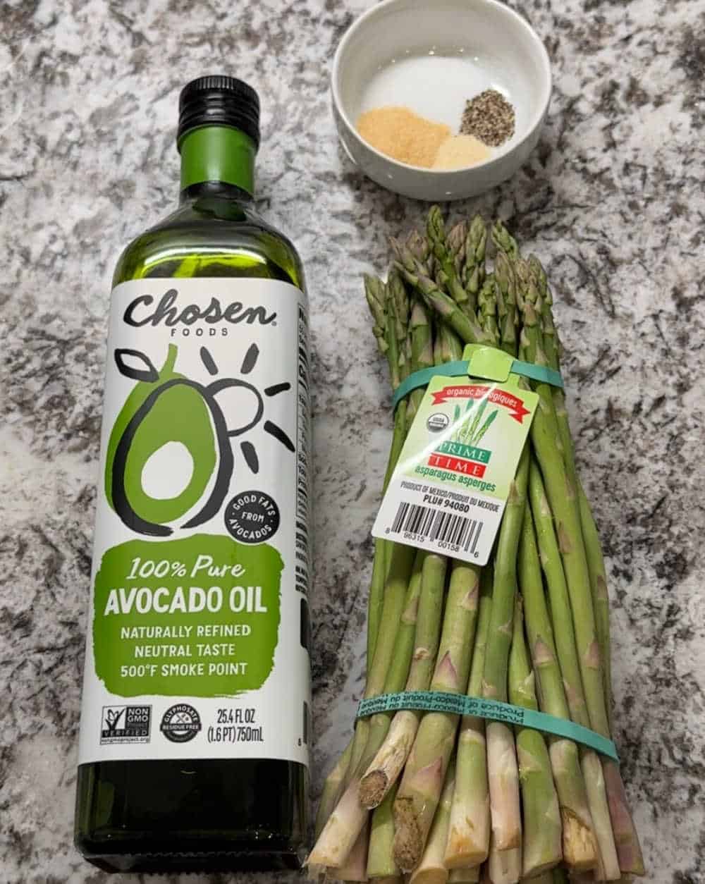 fresh bunch of asparagus, avocado oil and spices.