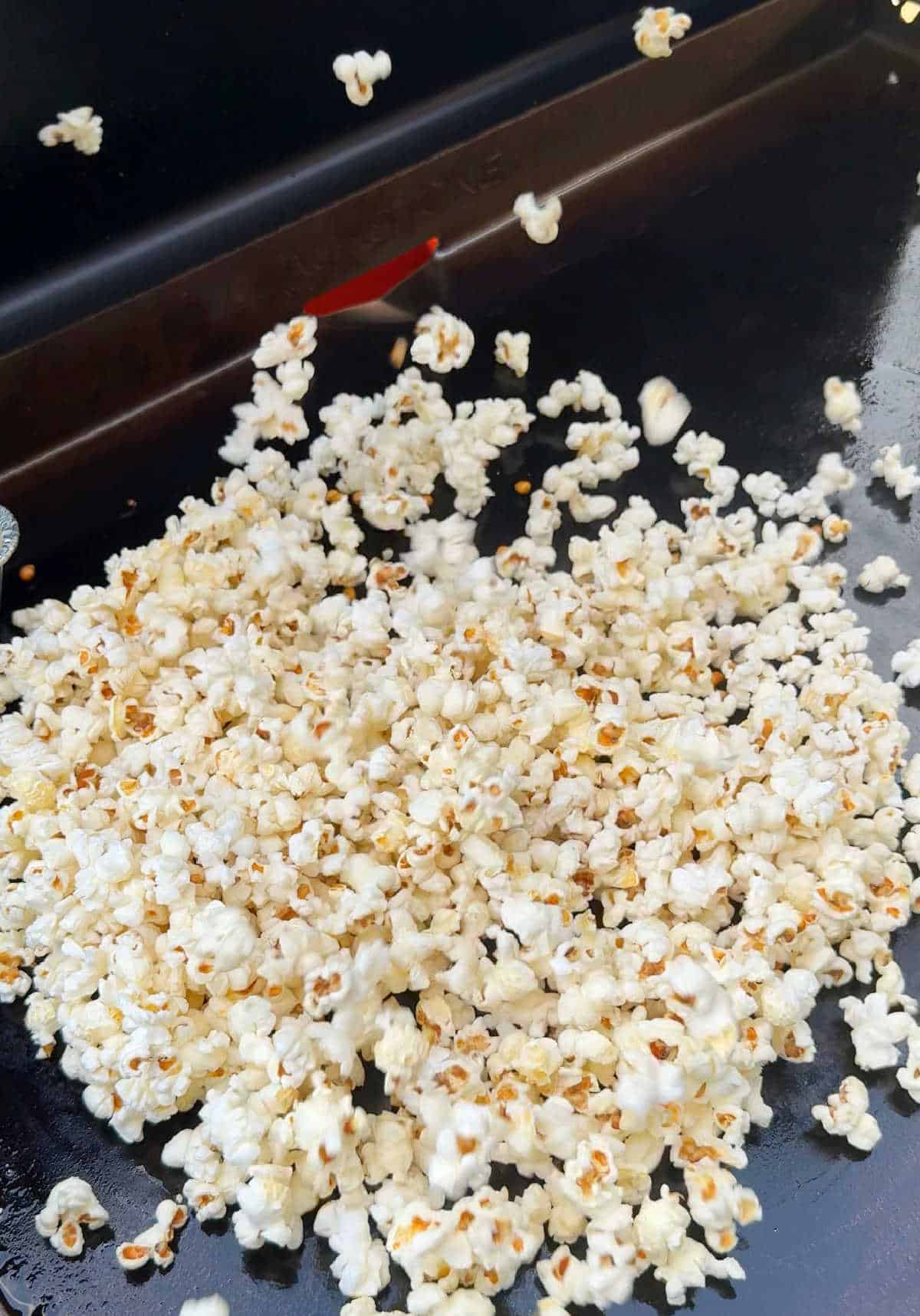 popcorn popping on griddle.