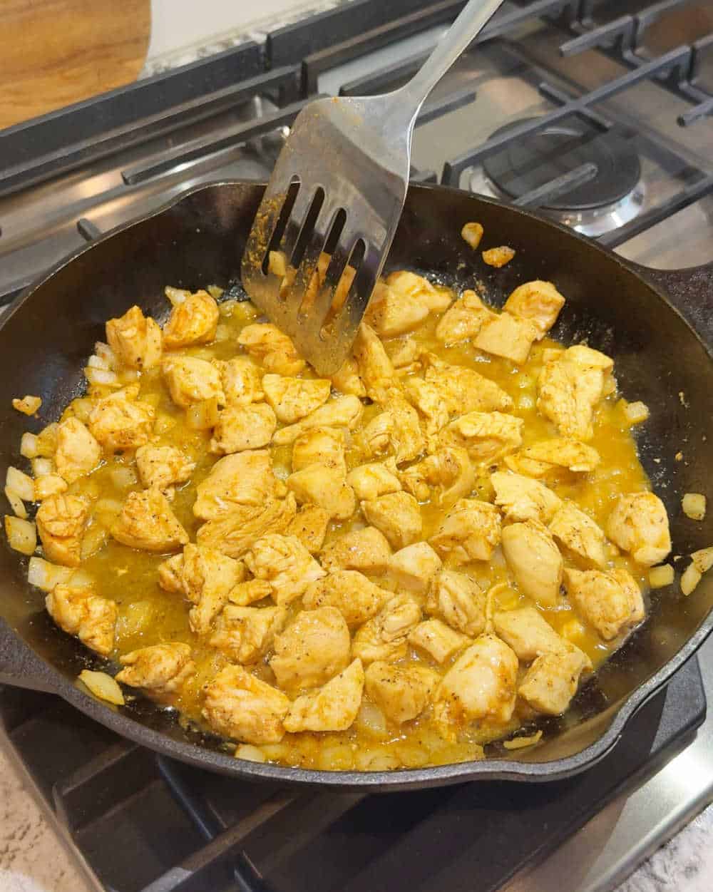 cooking chicken in skillet.