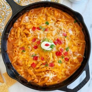 chicken enchilada pasta in a cast iron skillet.
