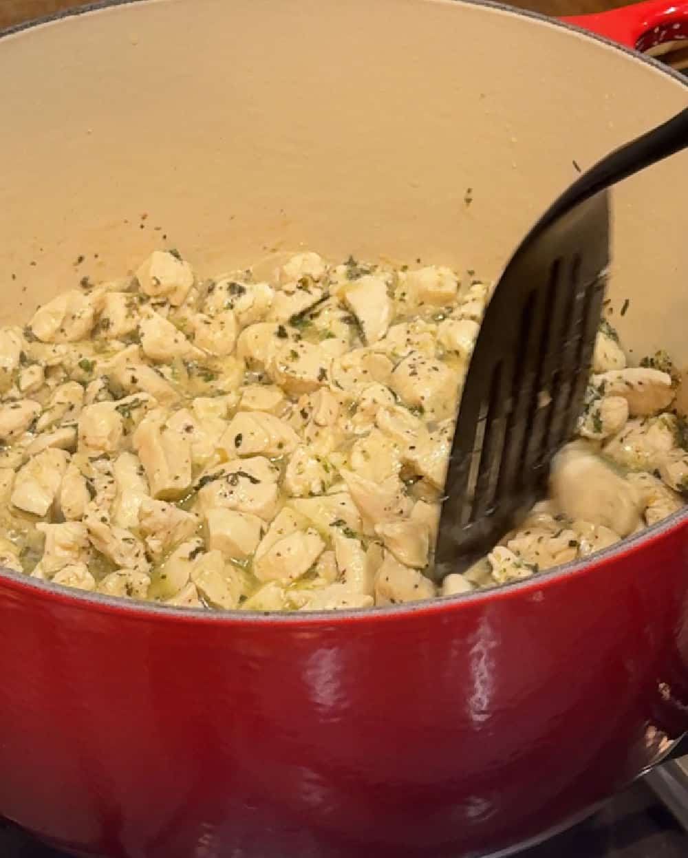 pieces of chicken in dutch oven.