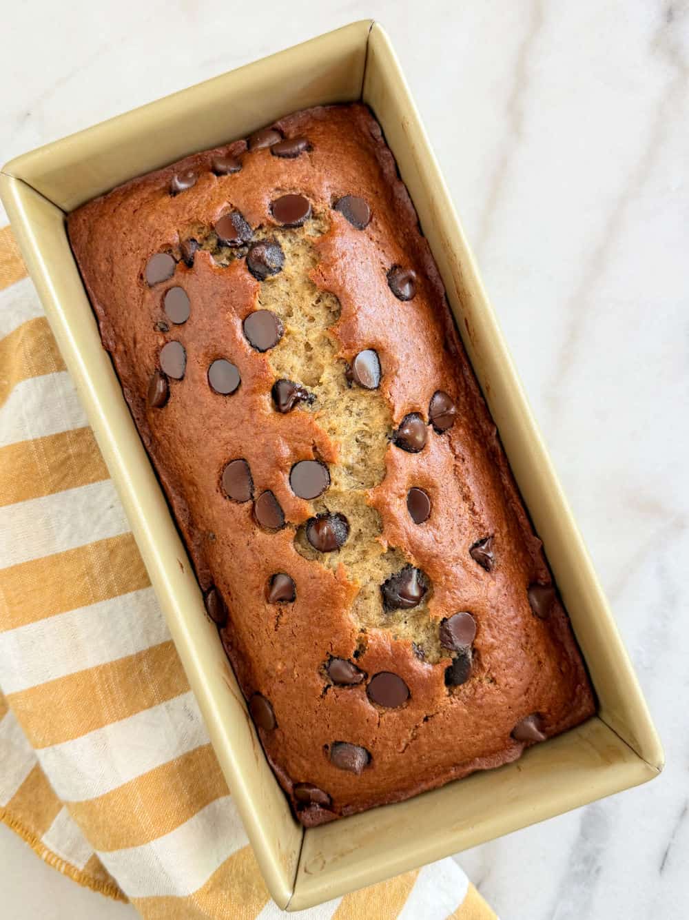 baked banana bread in loaf pan.