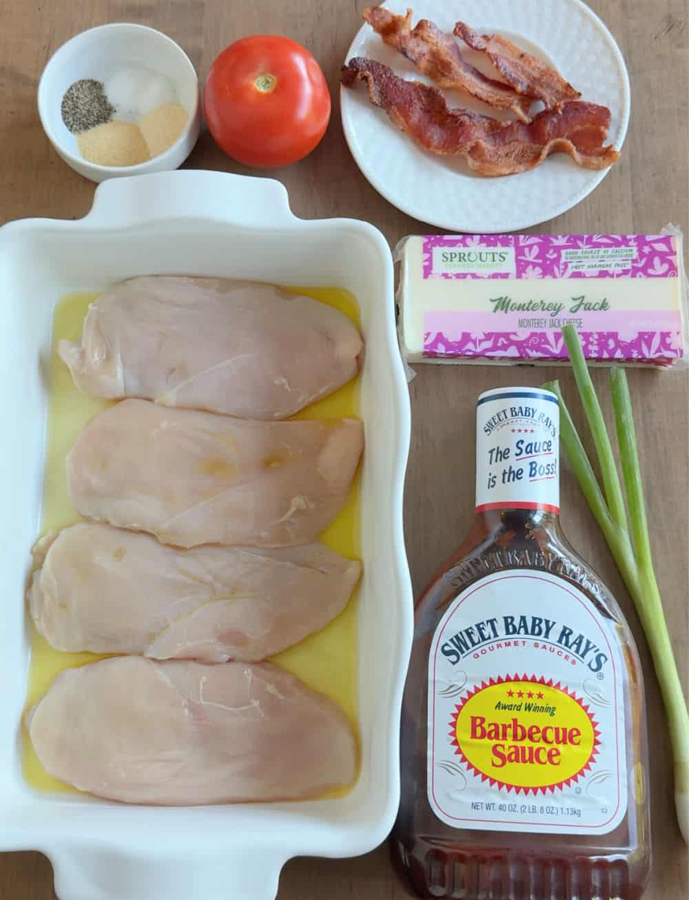 chicken breast, bbq sauce, bacon, cheese, spices, tomato, onion.