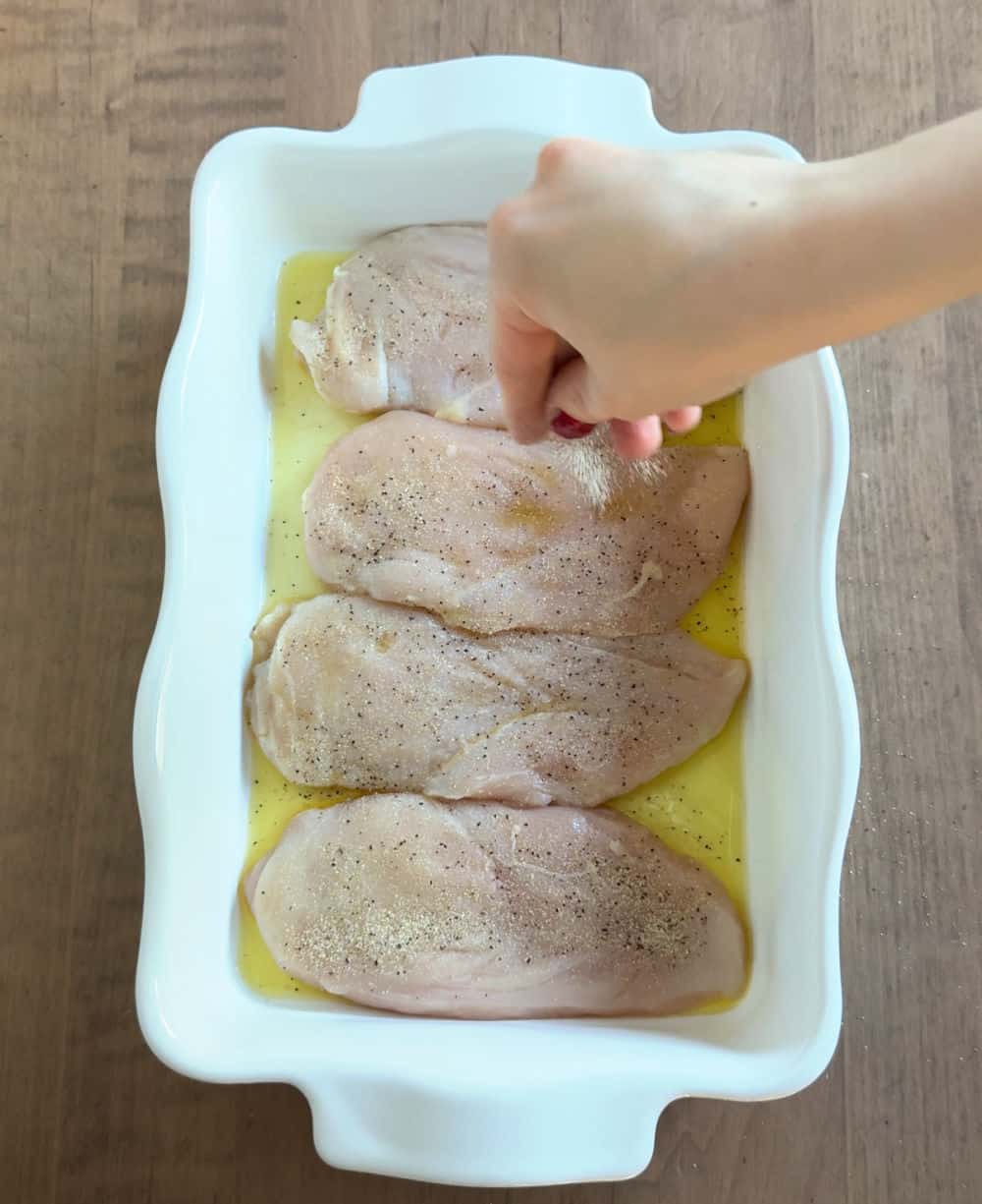 seasoning the chicken.