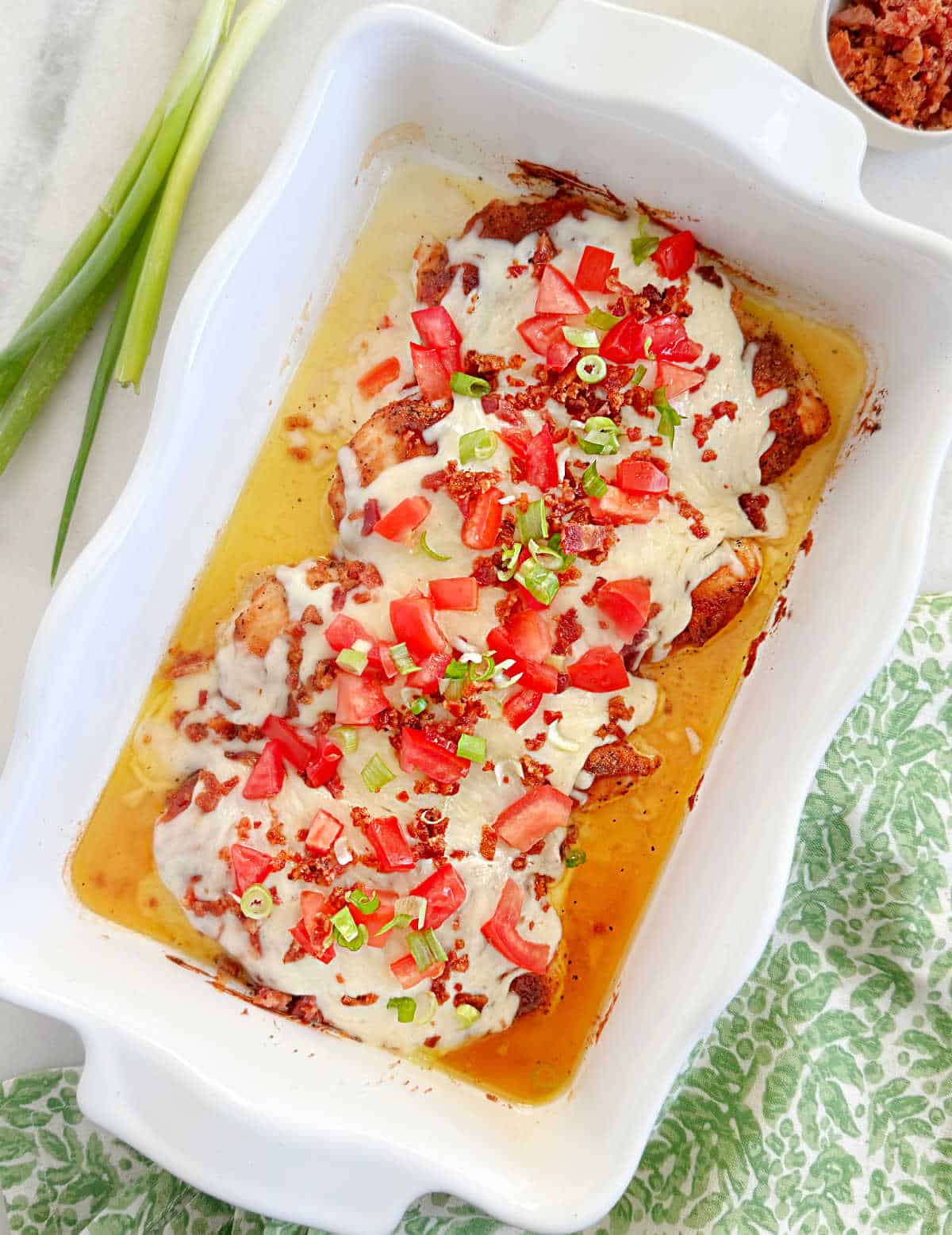 baked Monterey chicken in white casserole dish.