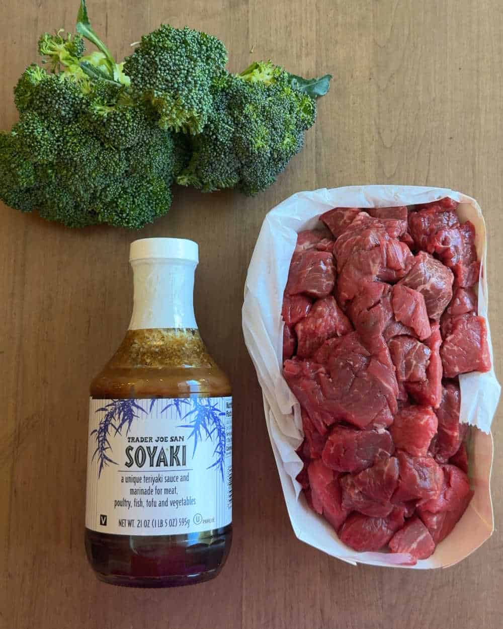 beef stew meat, broccoli florets, bottle of trader joe soyaki.