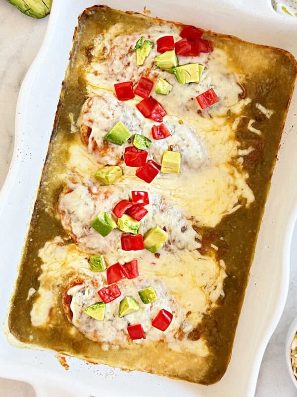 baked salsa verde chicken in casserole dish.