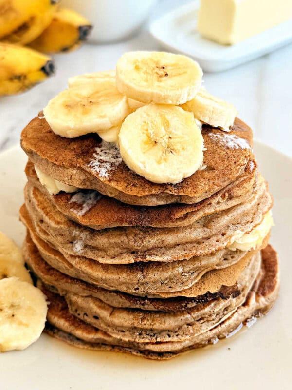 stack of banana cinnamon pancakes on plate.