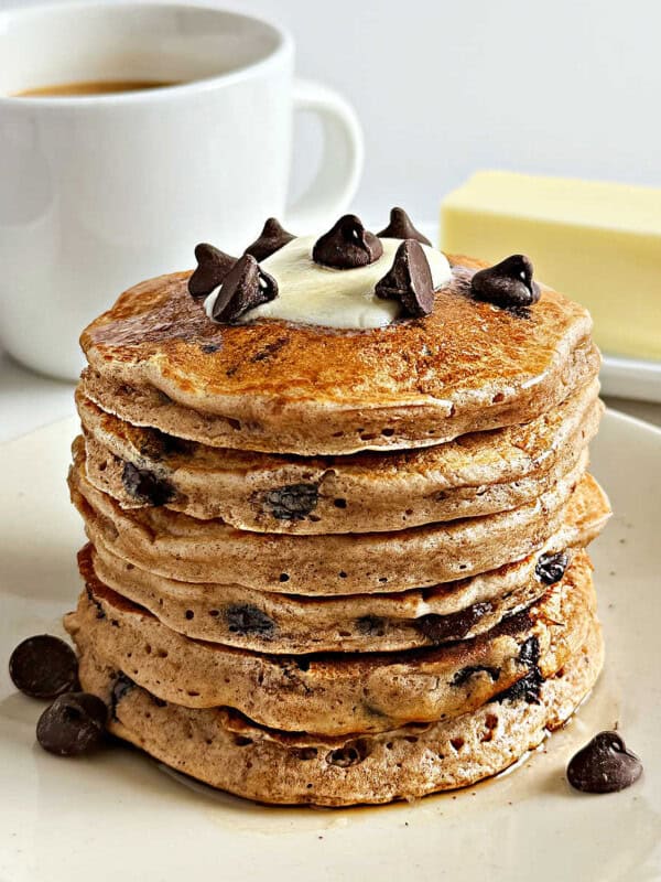 stack of chocolate chip pancakes with butter.