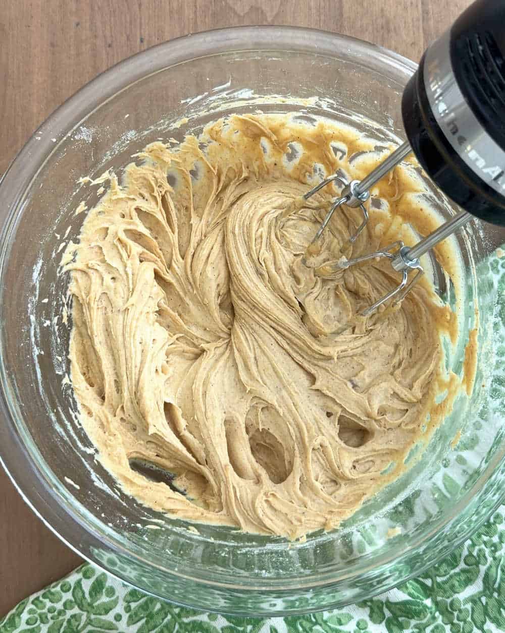 mixing batter in bowl with electric mixer.