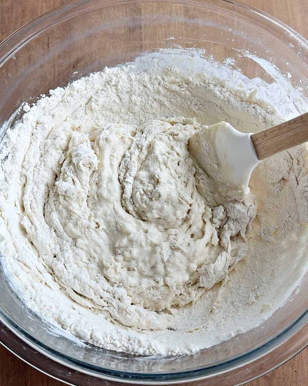 stirring in flour with spatula.