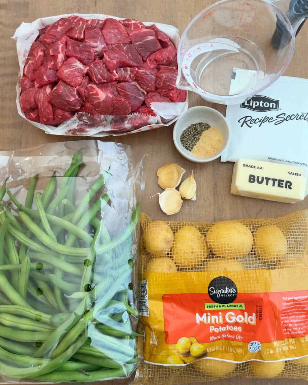 beef stew meat, baby potatoes, green beans, butter and seasonings.