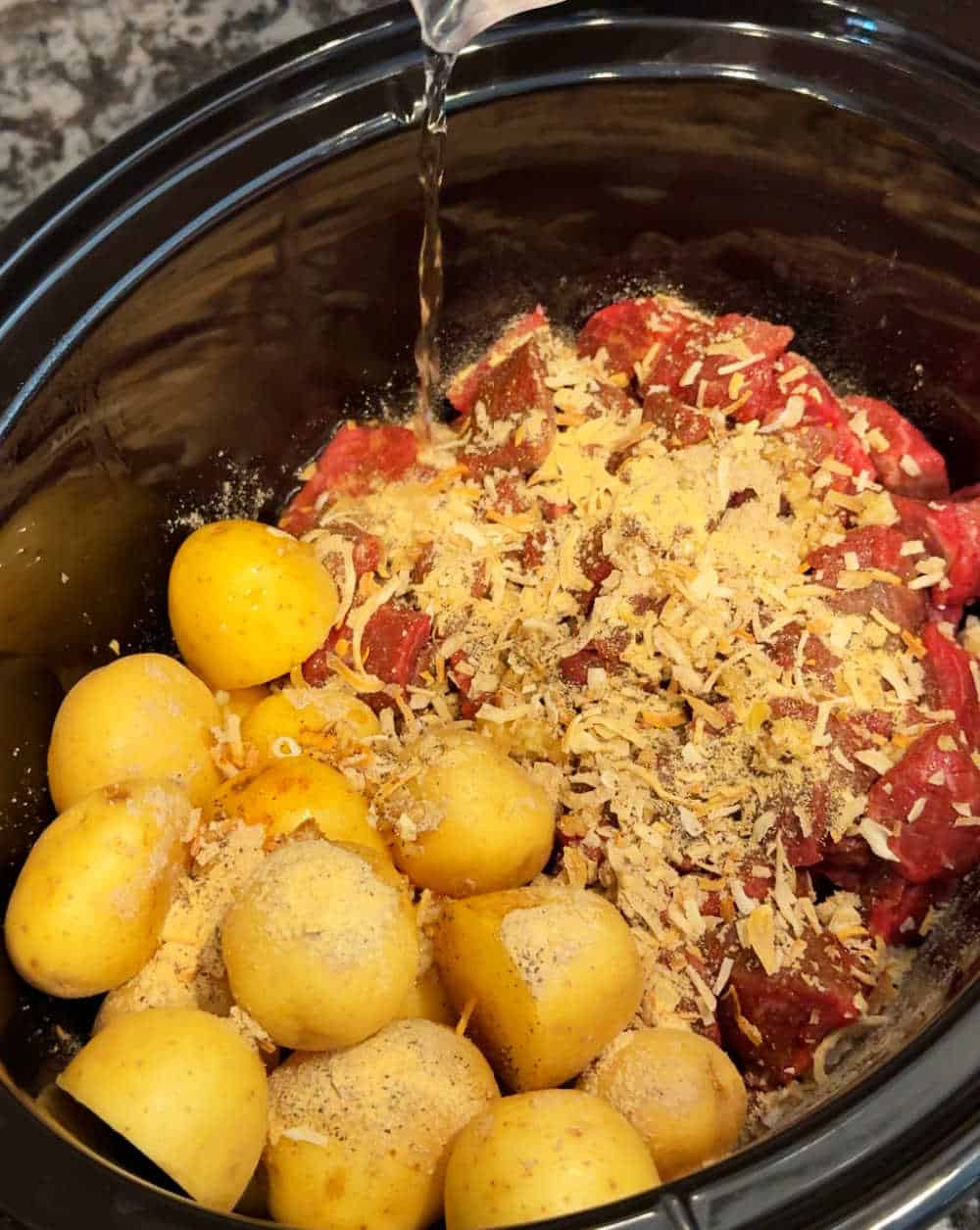 pour water into slow cooker.
