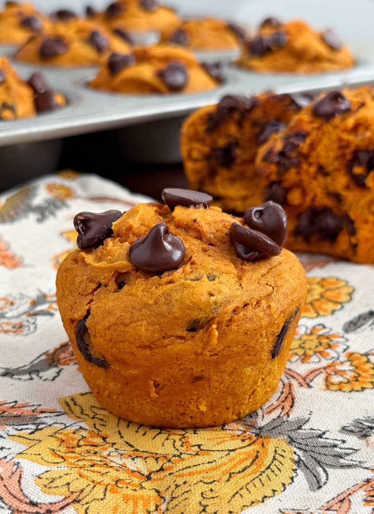 cake mix pumpkin muffins with chocolate chips on the table.