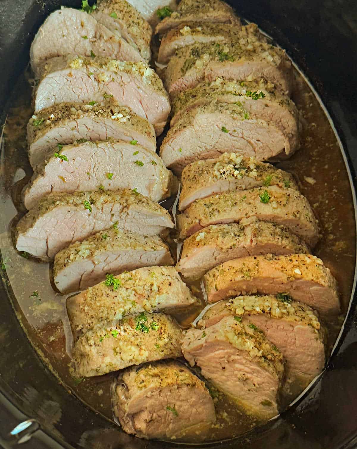 garlic butter crock pot pork tenderloin in slow cooker.