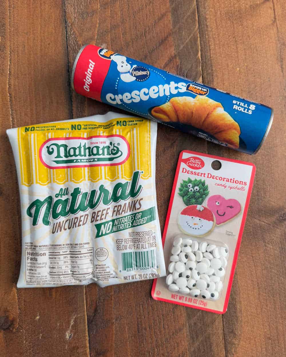 crescent rolls, hot dogs, candy eyeballs.