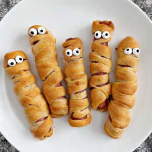 mummy dogs for halloween on a plate.