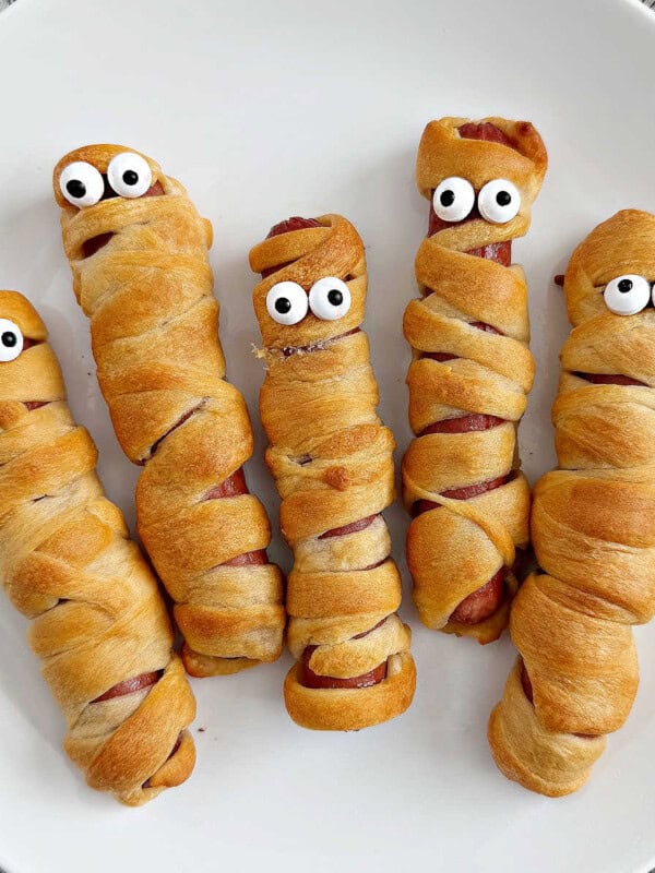 mummy dogs for halloween on a plate.