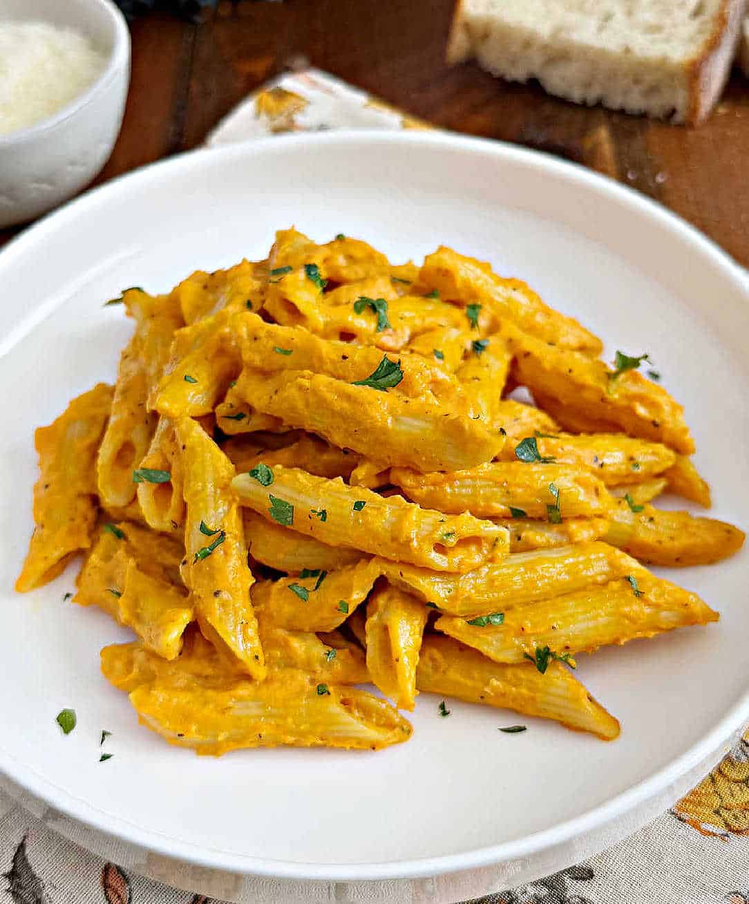 pumpkin pasta on a white plate.