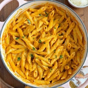 penne with pumpkin pasta sauce in Dutch oven.