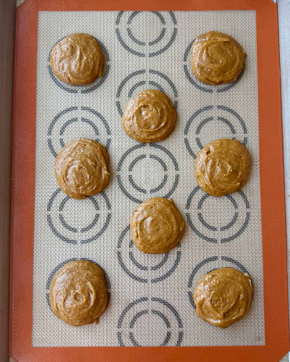 baking pumpkin rounds on baking sheet.